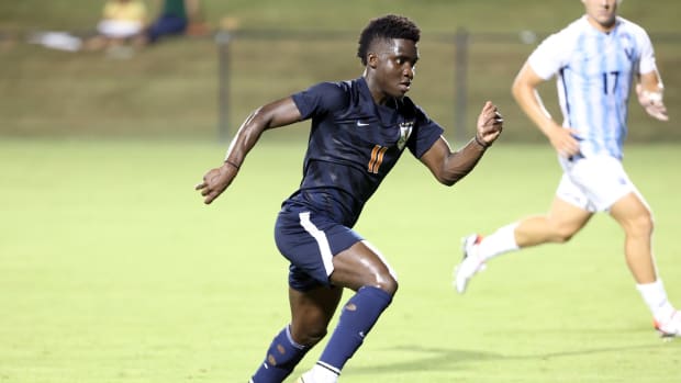 Mouhameth Thiam dribbles the ball forward during the Virginia men's soccer exhibition match against Villanova at Klockner Stadium.